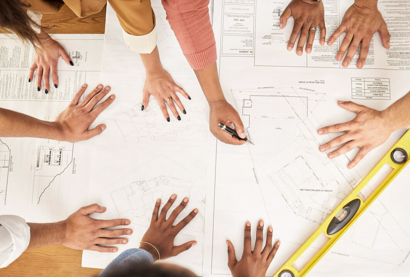 Designer revisiting interior sketch post-delivery